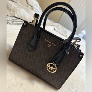 Black and brown Michael Kors handbag.